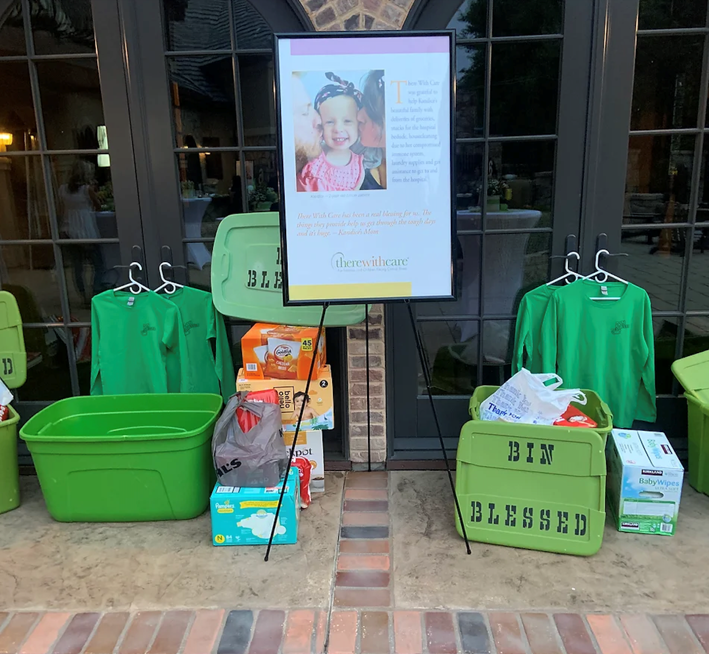 Green Bin Blessed bins filled with donations such as baby supplies and easy to grab snacks.